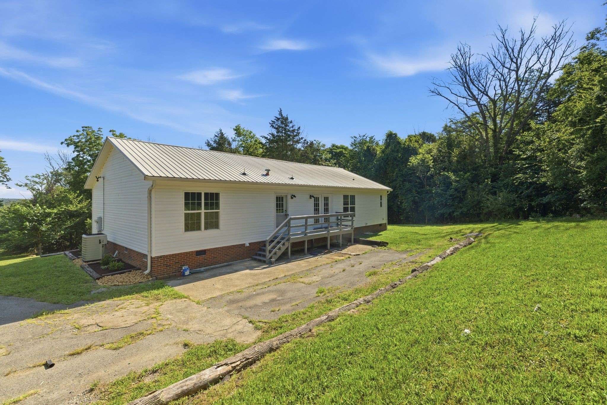 1021 B Jordan Road Lascassas, TN 37085 - Photo 50 of 58 a view of a house with yard and sitting area