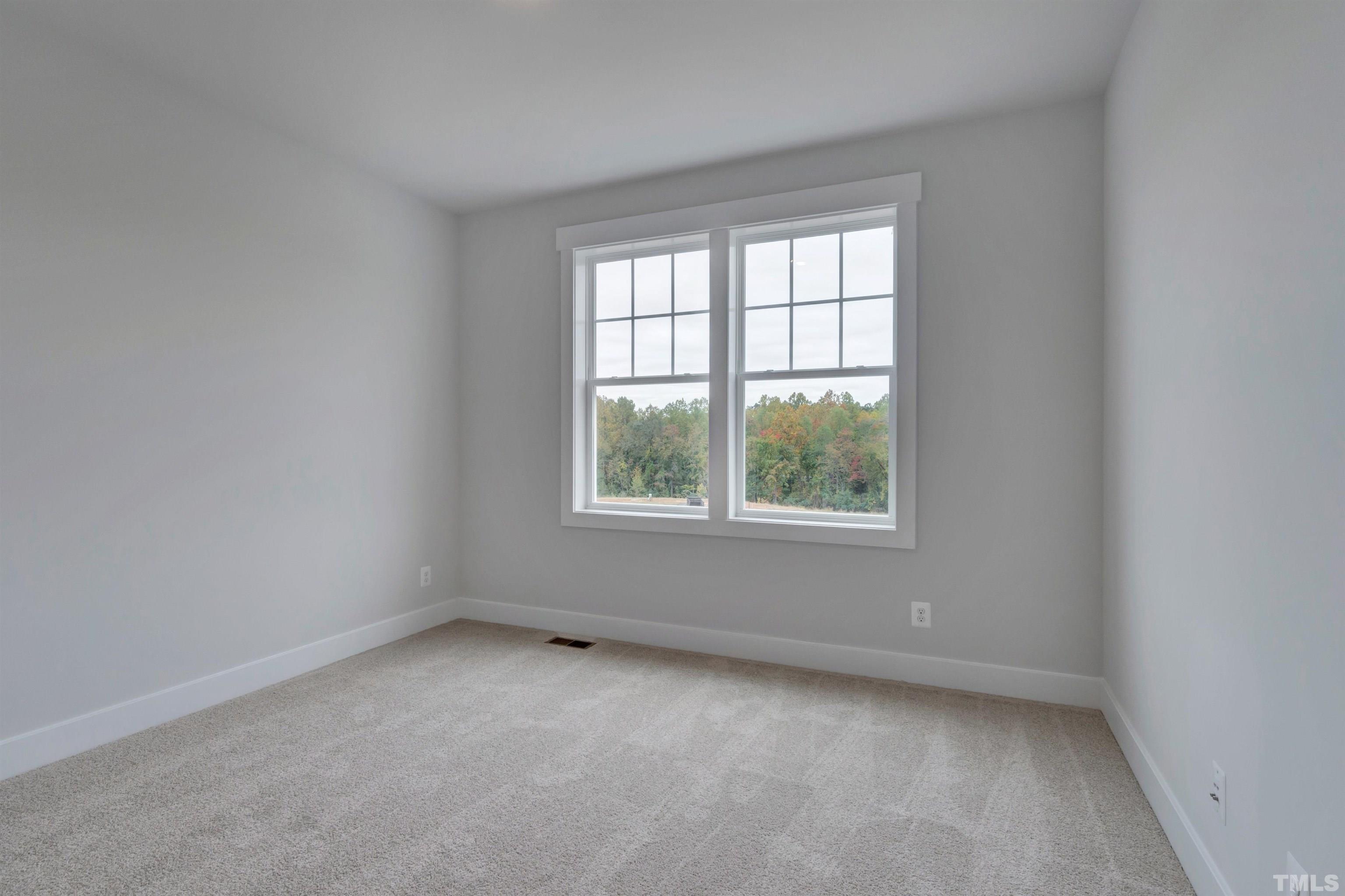 159 Dunloe Loop Raleigh, NC 27603 - Photo 9 of 19 an empty room with a window