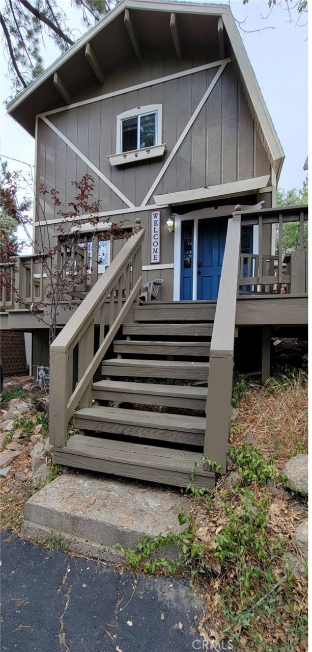 33076 Robin Lane Running Springs, CA 92382 - Photo 2 of 10 a front view of a house with a yard