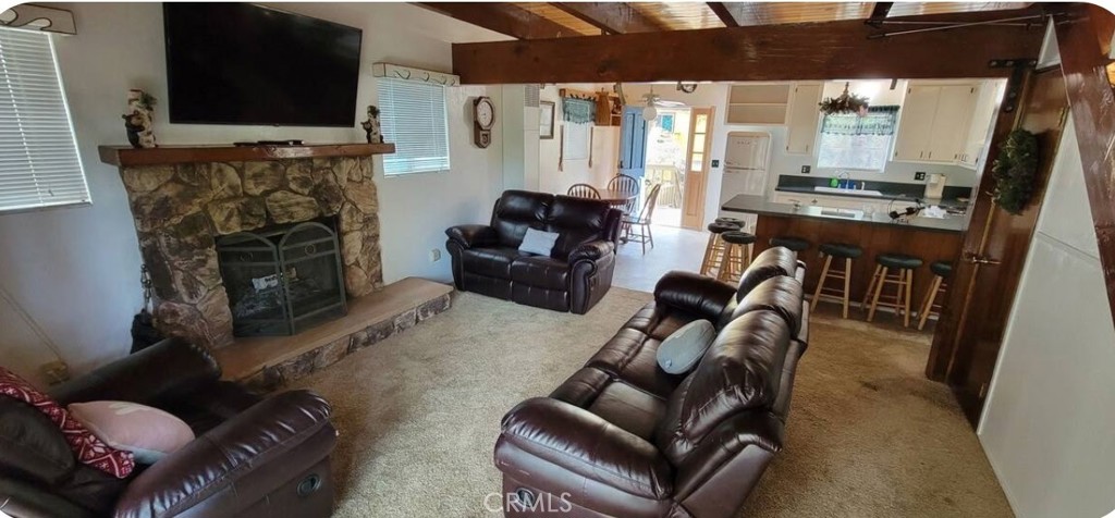 33076 Robin Lane Running Springs, CA 92382 - Photo 4 of 10 a living room with furniture and a fireplace