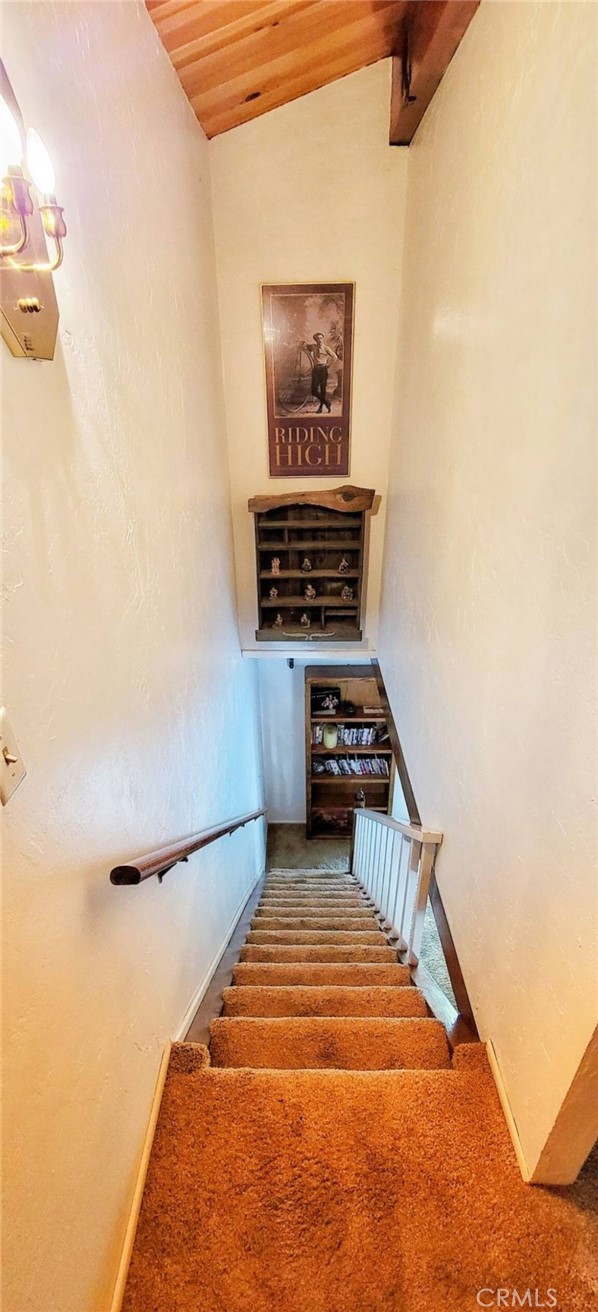 33076 Robin Lane Running Springs, CA 92382 - Photo 8 of 10 a hallway with a stove and a painting on the wall
