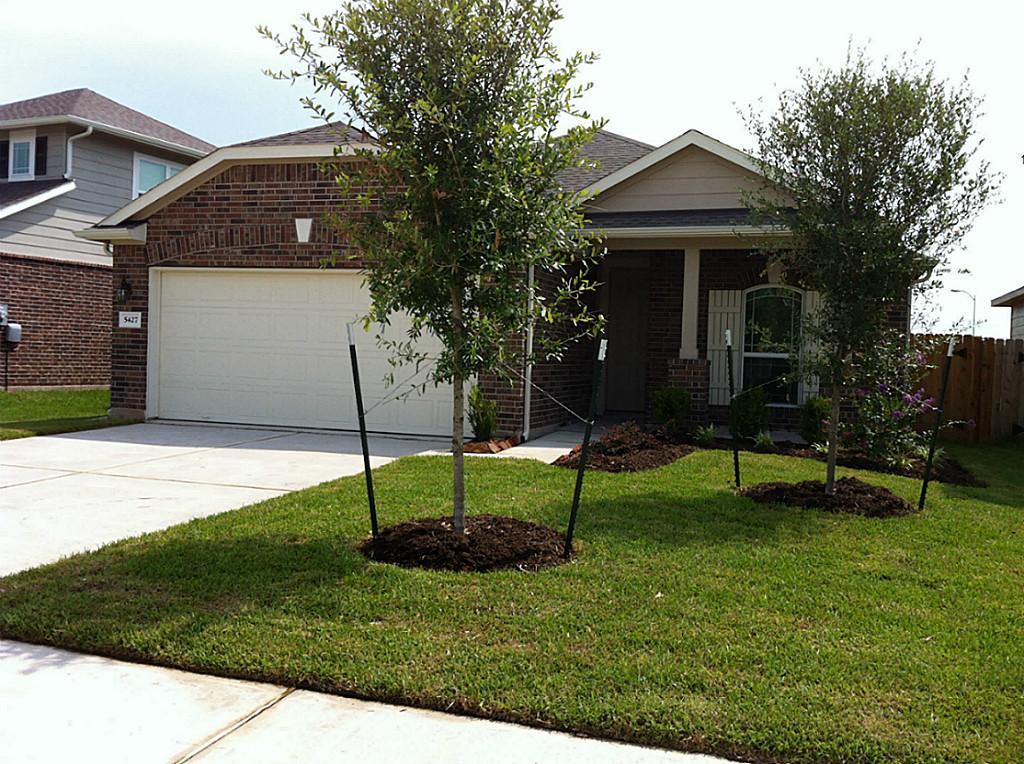a backyard of a house with lots of green space