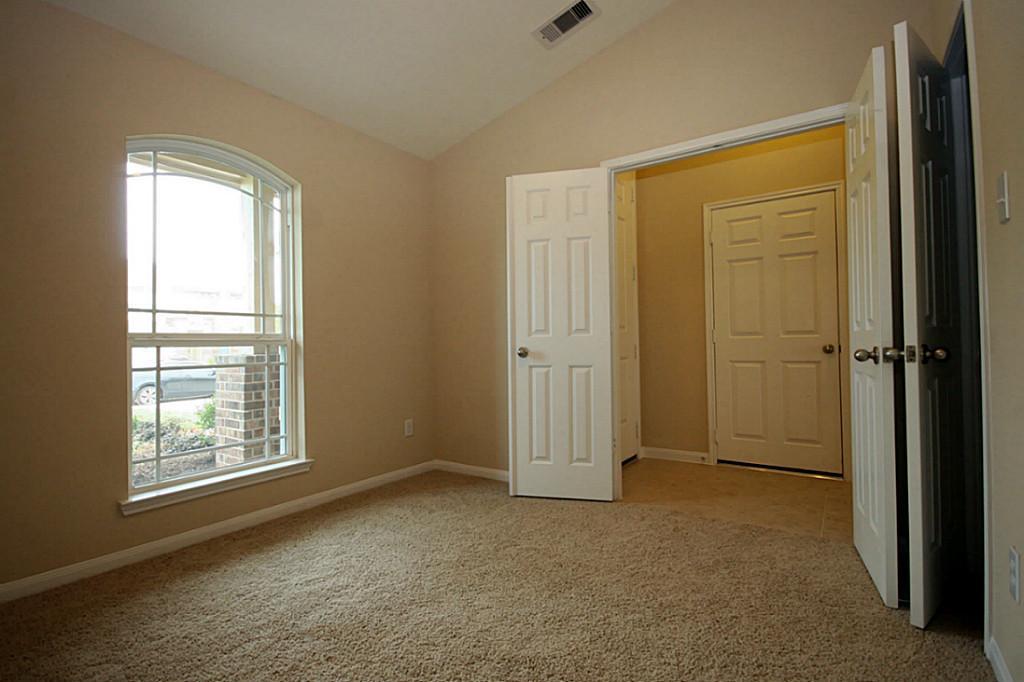 5427 Marble Ravine Richmond, TX 77407 - Photo 11 of 17 an empty room with windows