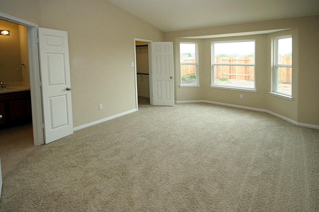 5427 Marble Ravine Richmond, TX 77407 - Photo 15 of 17 an empty room with windows and closet
