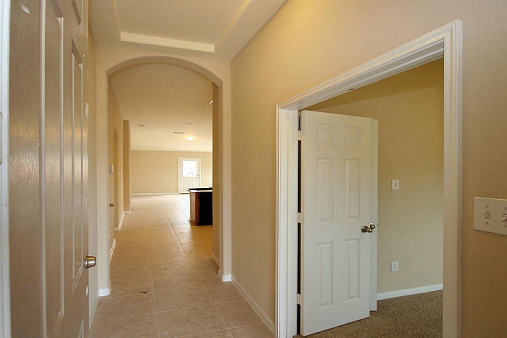 5427 Marble Ravine Richmond, TX 77407 - Photo 16 of 17 a view of a hallway with wooden floor