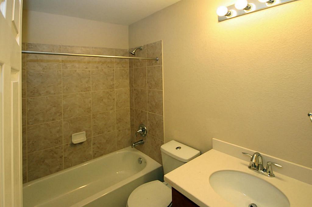 5427 Marble Ravine Richmond, TX 77407 - Photo 17 of 17 a bathroom with a sink toilet and shower