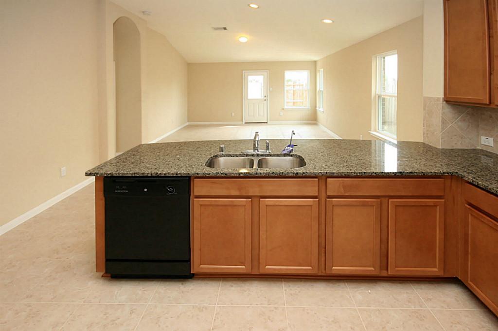 5427 Marble Ravine Richmond, TX 77407 - Photo 5 of 17 a bathroom with a granite countertop sink and a mirror