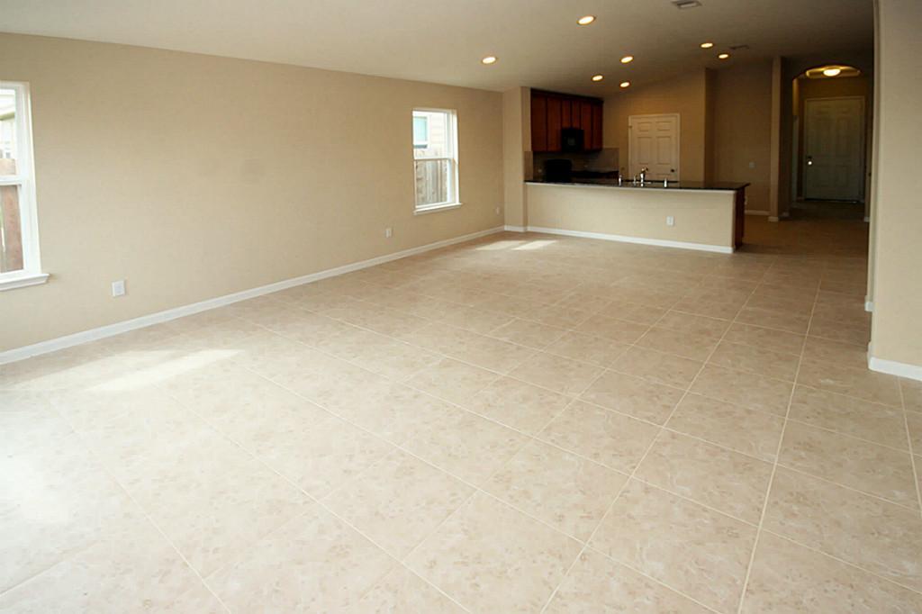 5427 Marble Ravine Richmond, TX 77407 - Photo 8 of 17 a view of an empty room with a kitchen