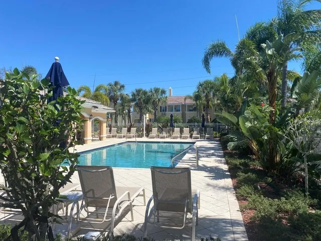 a view of a chairs and table in the patio