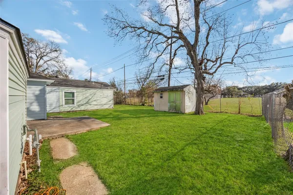 a backyard of a house with lots of green space