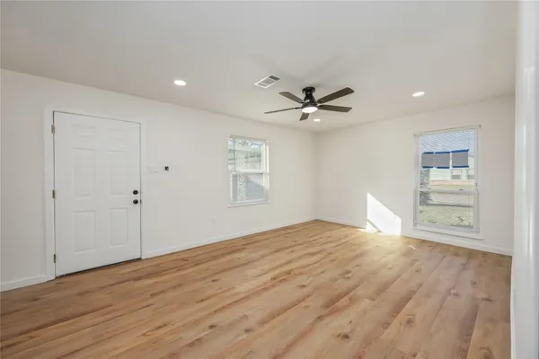 a view of an empty room with a window