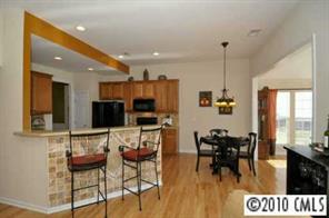 622 Panthers Way Fort Mill, SC 29708 - Photo 2 of 8 a living room with furniture and a flat screen tv