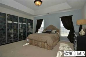 622 Panthers Way Fort Mill, SC 29708 - Photo 7 of 8 a bedroom with a bed and window