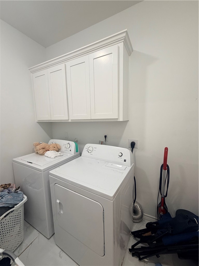 903 West Main Street Alice, TX 78332 - Photo 14 of 24 a view of storage and utility room with washer and dryer