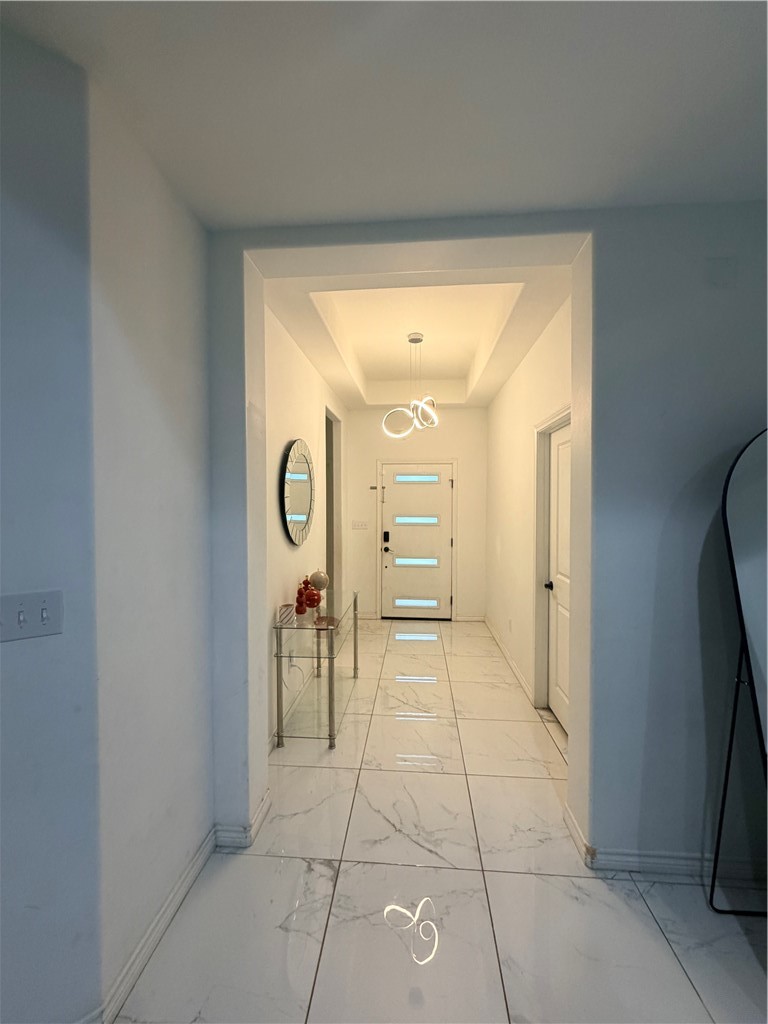 903 West Main Street Alice, TX 78332 - Photo 4 of 24 a view of a hallway with a dining table and chair