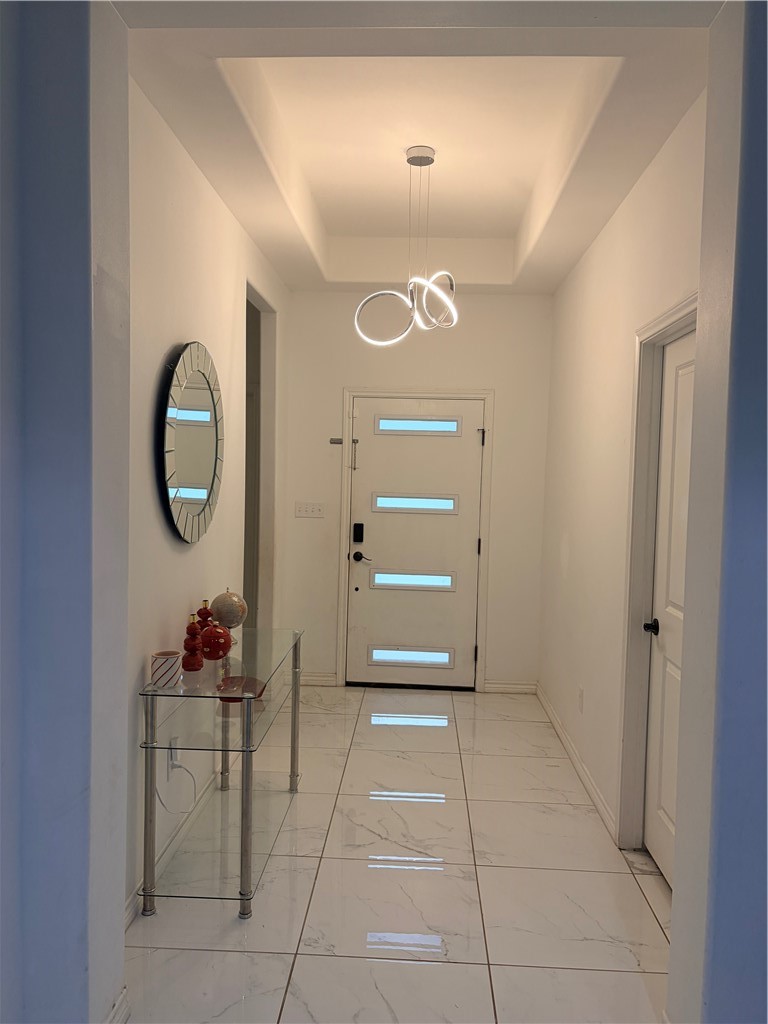 903 West Main Street Alice, TX 78332 - Photo 5 of 24 a view of a hallway with washer and dryer
