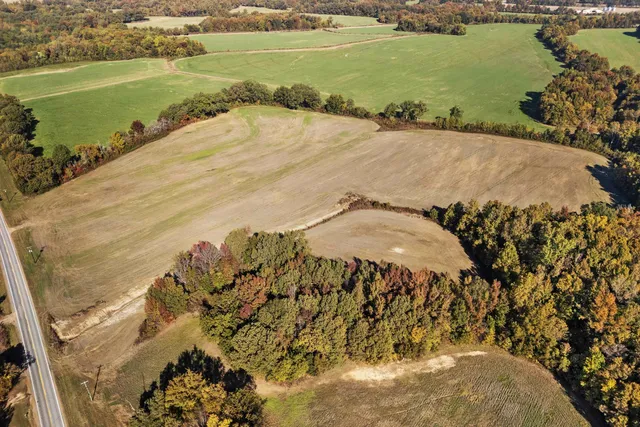 an aerial view of beach and residential houses with outdoor space