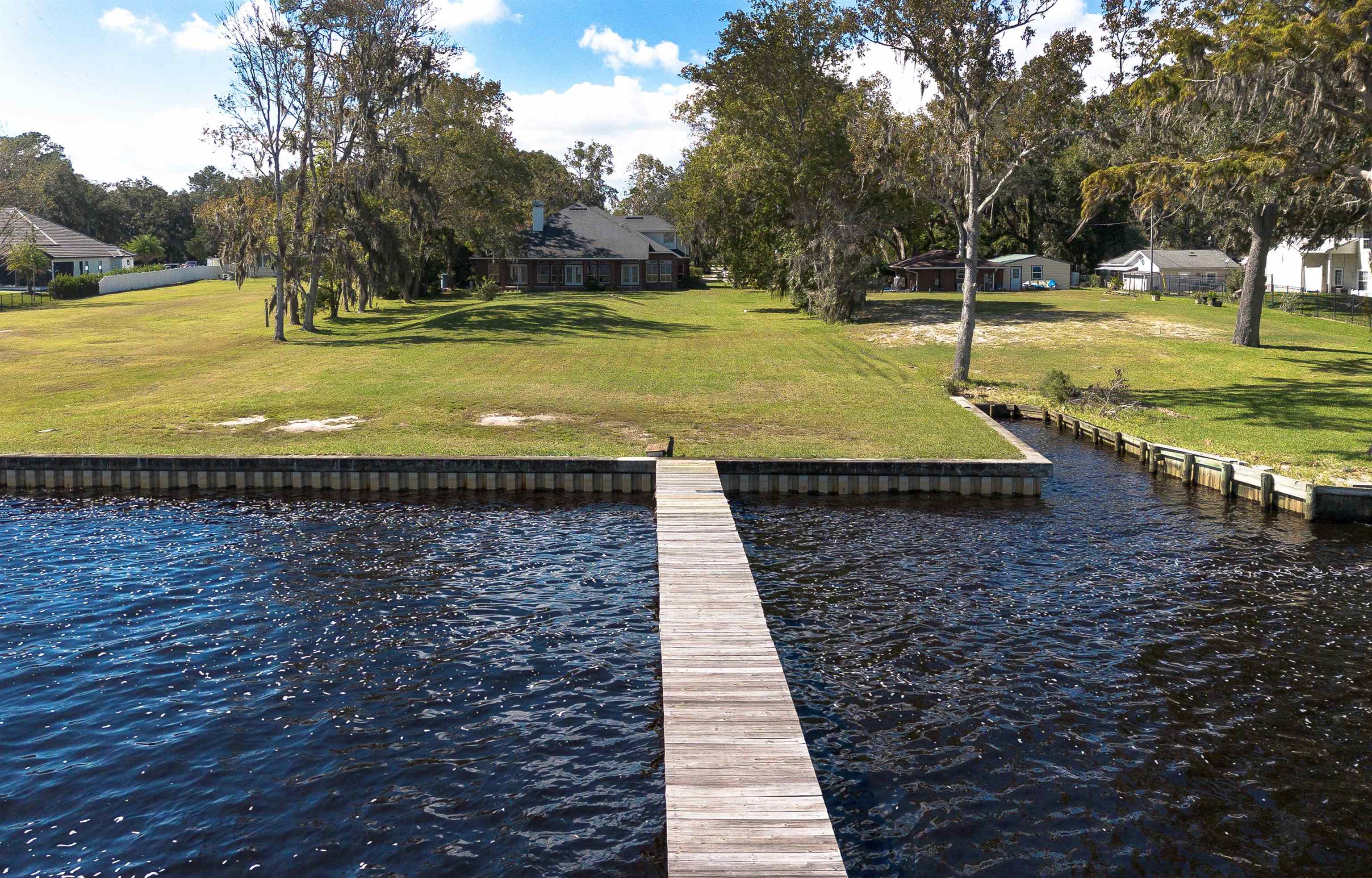 3593 Westover Road Fleming Island, FL 32003 - Photo 1 of 71 a view of a swimming pool with a patio and a yard