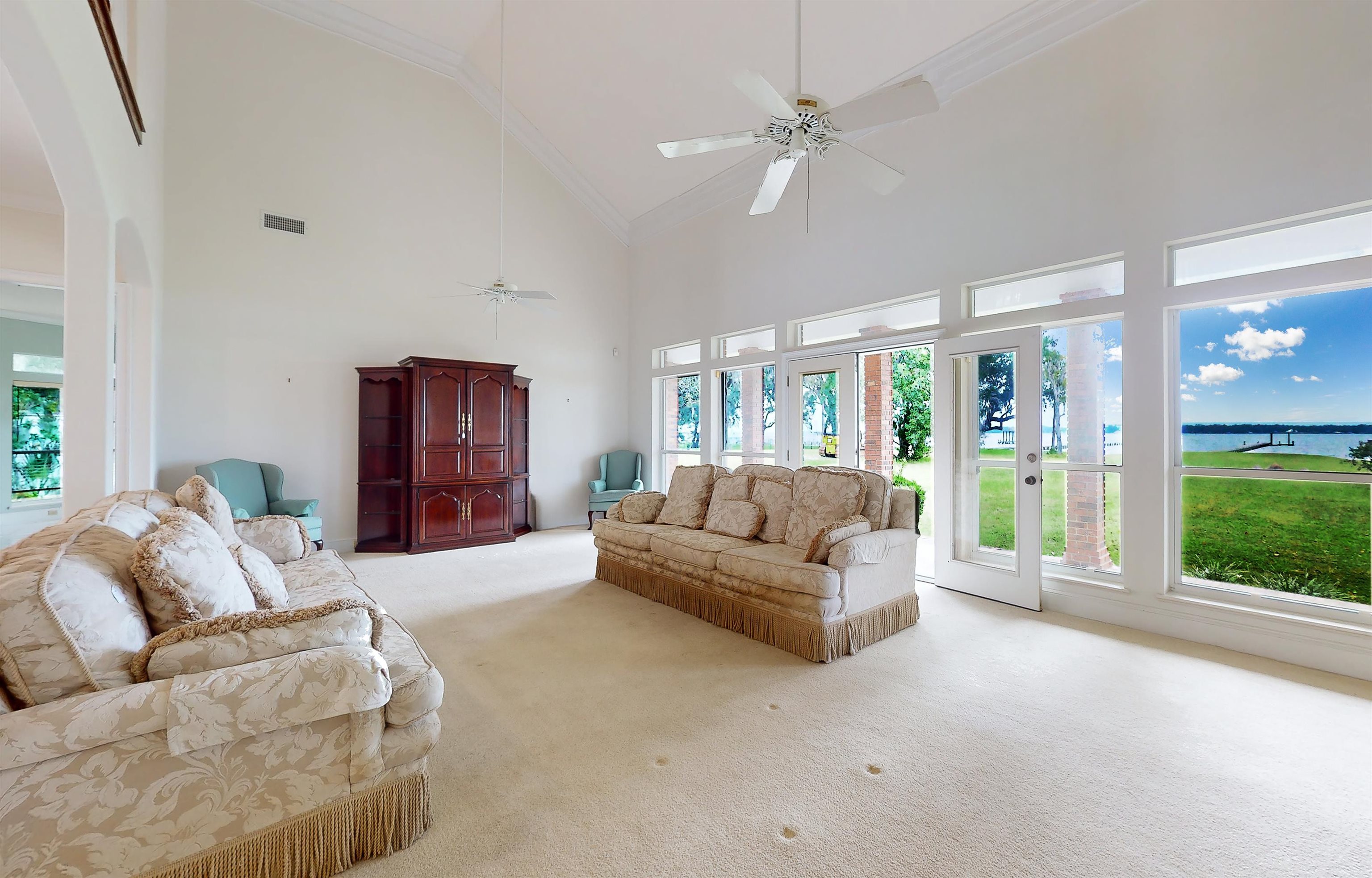 3593 Westover Road Fleming Island, FL 32003 - Photo 13 of 71 a living room with furniture and a large window