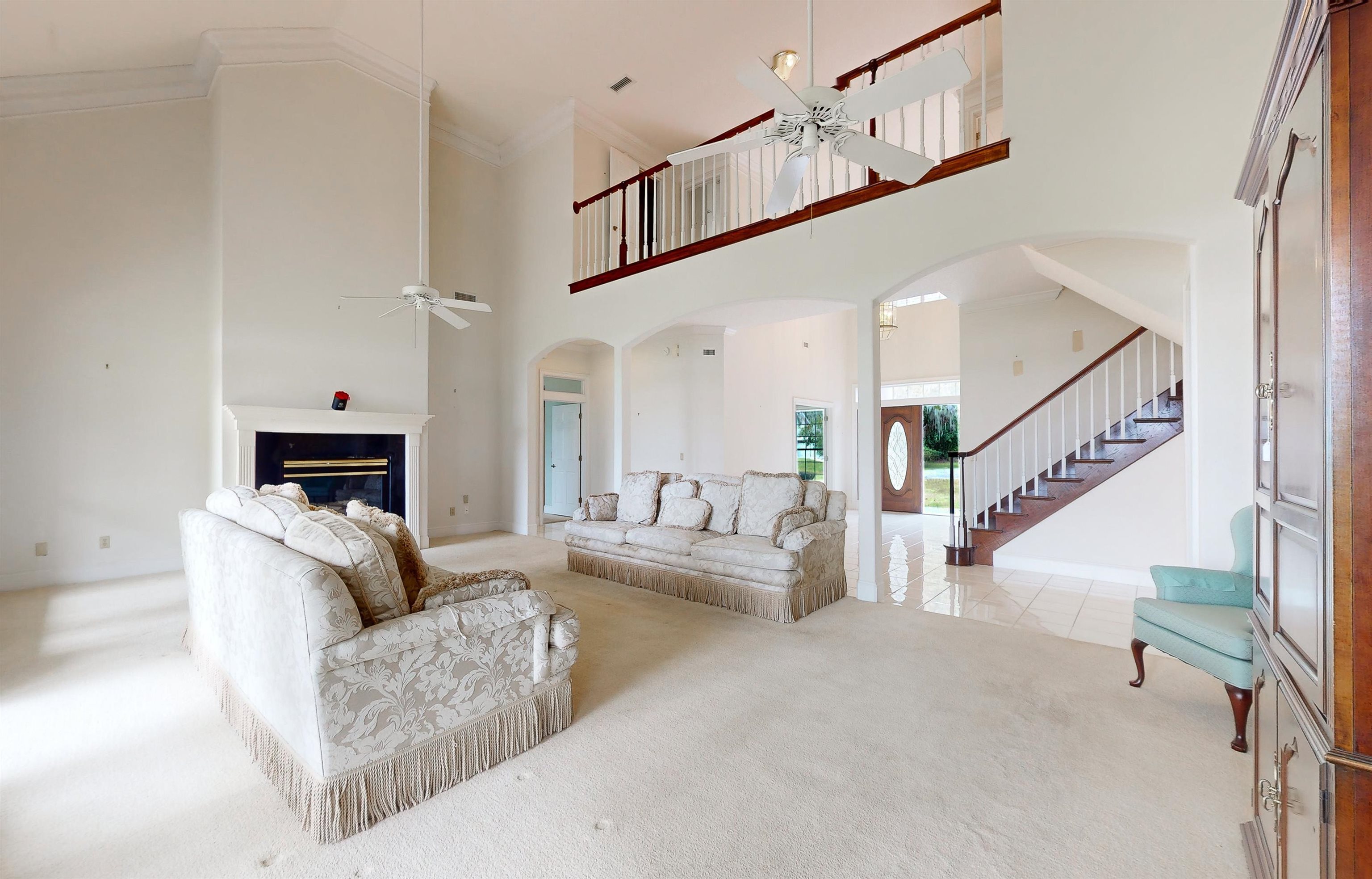 3593 Westover Road Fleming Island, FL 32003 - Photo 14 of 71 a living room with furniture and a fireplace