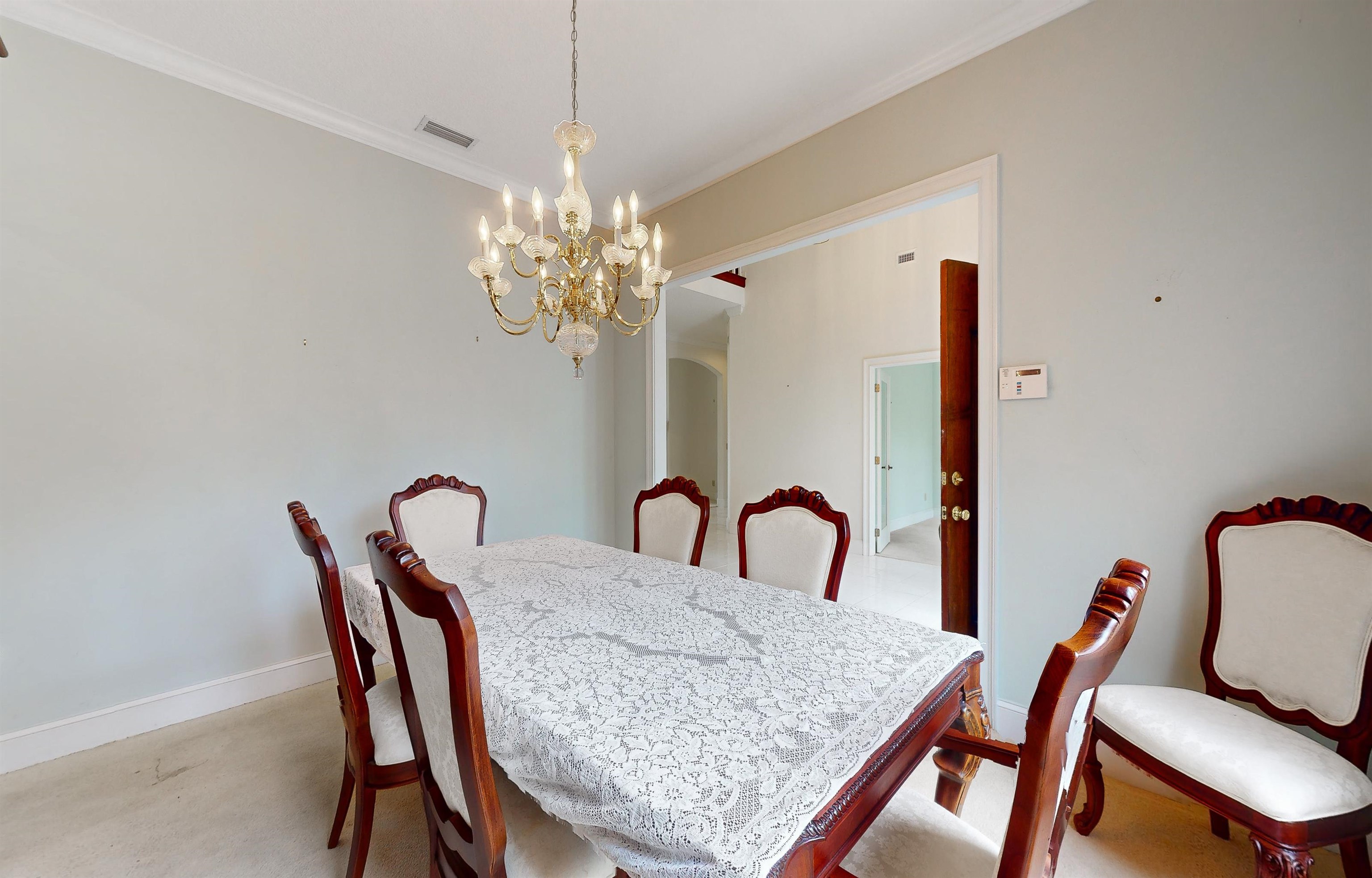 3593 Westover Road Fleming Island, FL 32003 - Photo 19 of 71 a dining room with furniture a chandelier and window