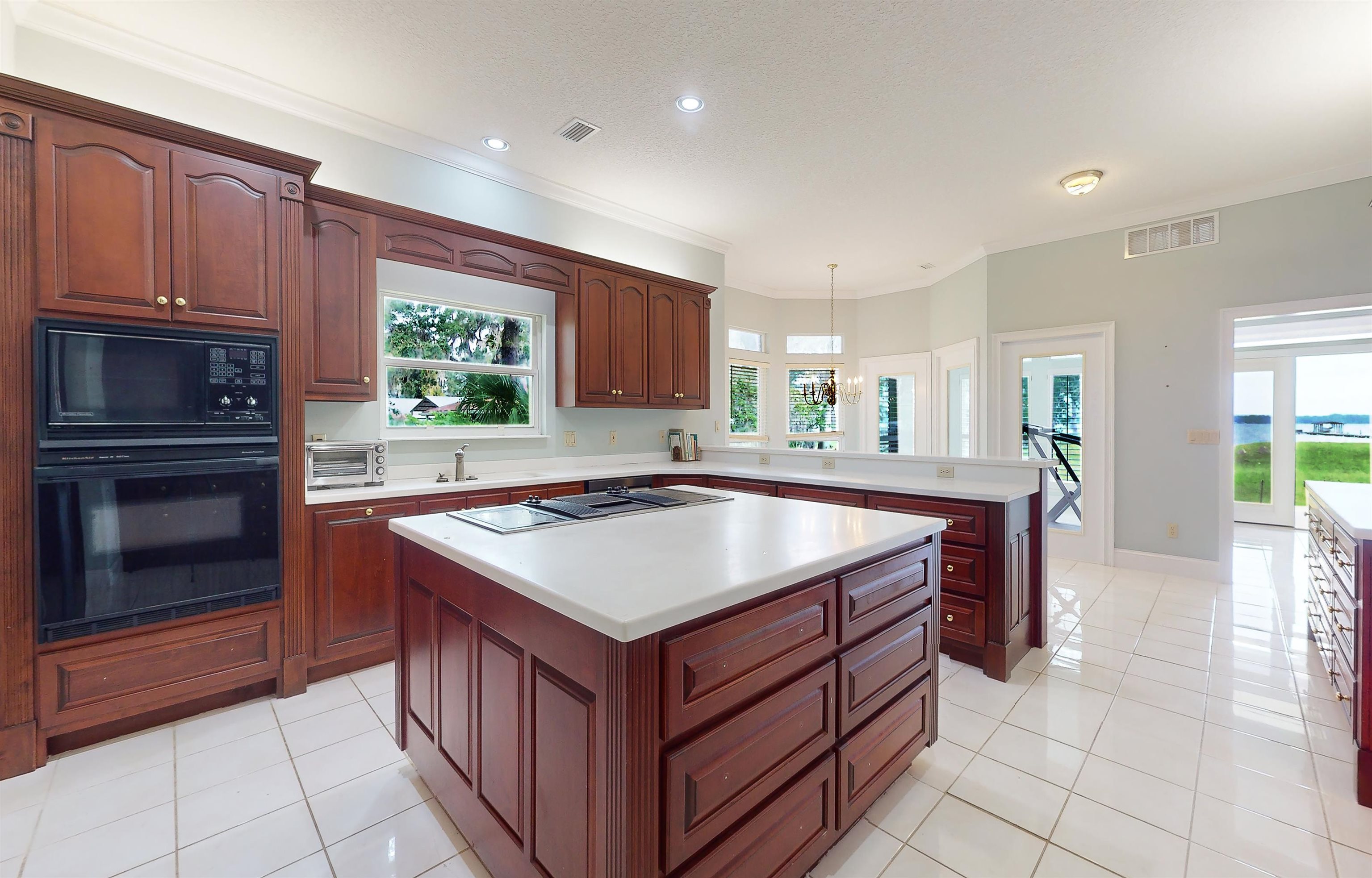 3593 Westover Road Fleming Island, FL 32003 - Photo 21 of 71 a kitchen with a stove sink and cabinets