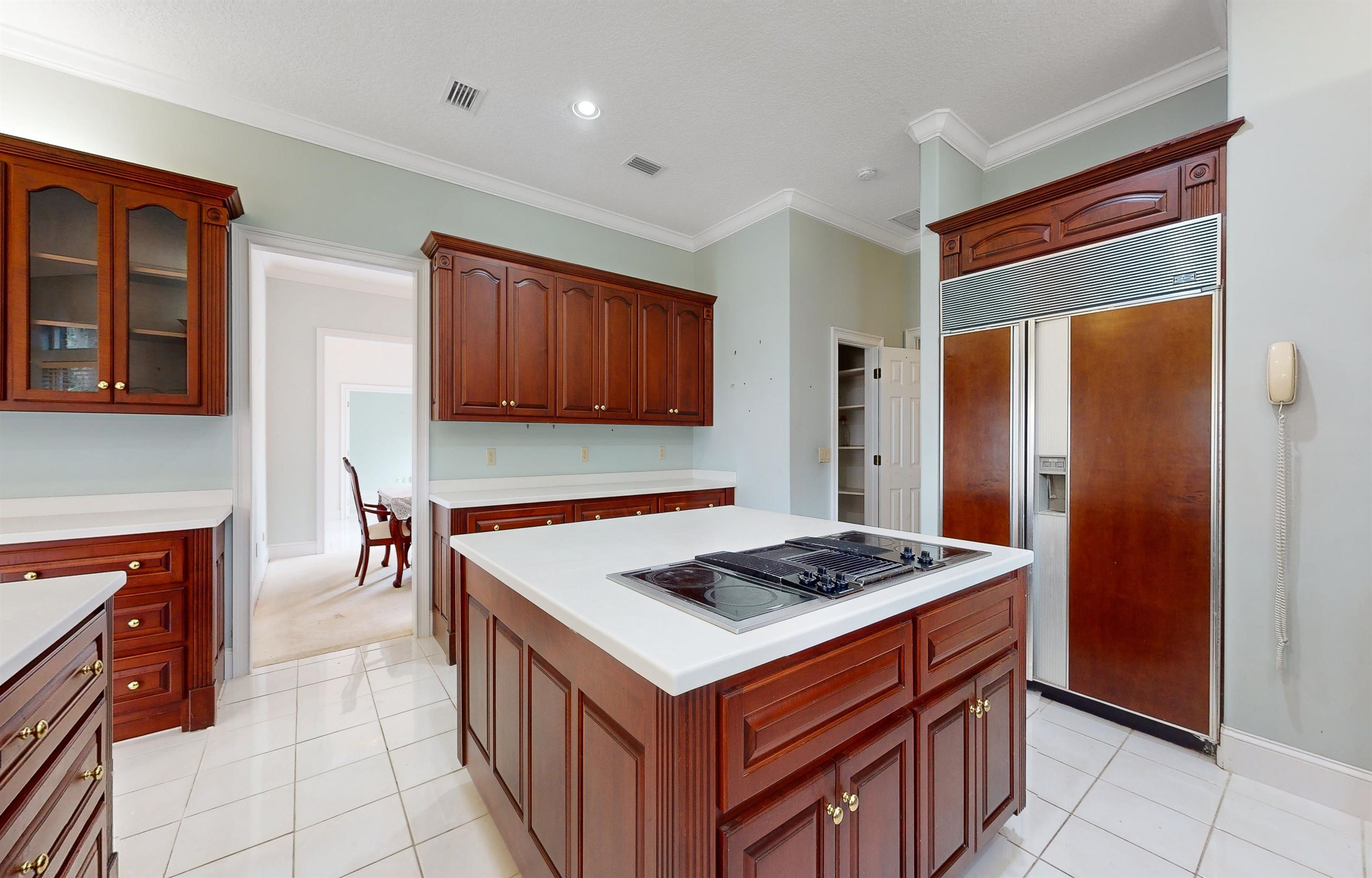 3593 Westover Road Fleming Island, FL 32003 - Photo 22 of 71 a kitchen that has a kitchen island wooden cabinets and stainless steel appliances