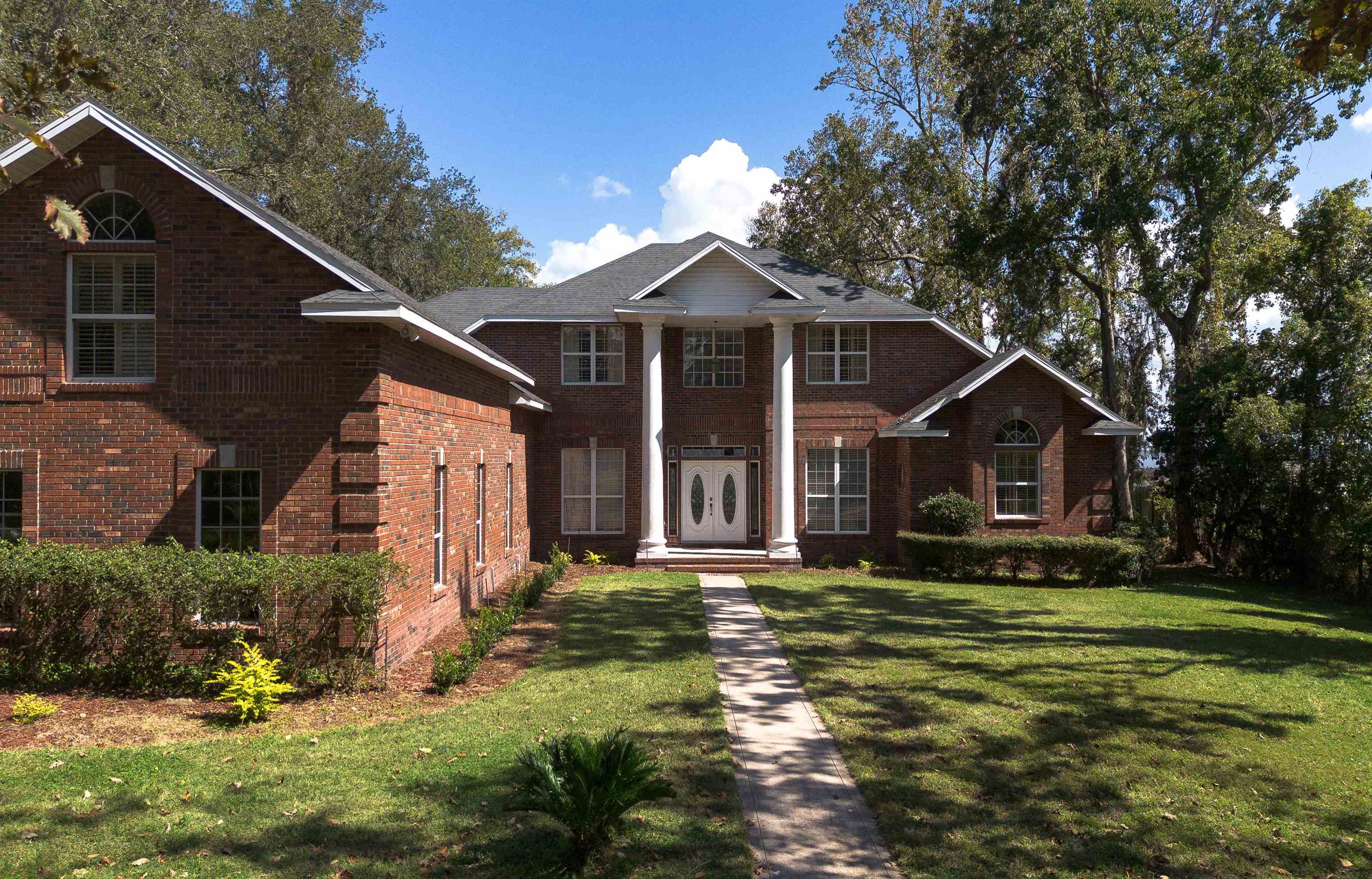 3593 Westover Road Fleming Island, FL 32003 - Photo 5 of 71 a front view of a house with a yard