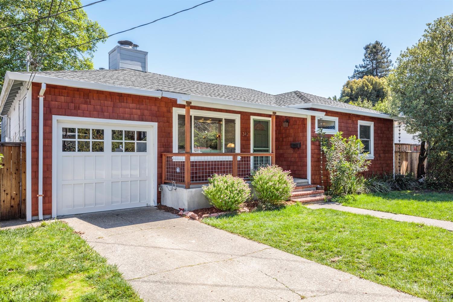 342 Irwin Street San Rafael, CA 94901 - Photo 1 of 1 a view of a house with brick walls and a yard with plants