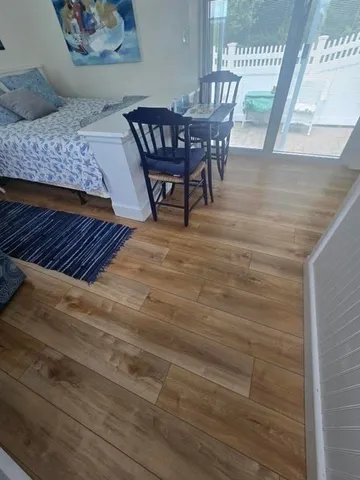 a living room with furniture and a rug