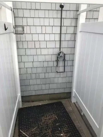 a view of a house with a yard and garage