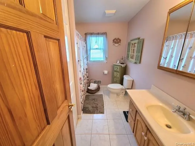 a view of a room with wooden floor and wardrobe