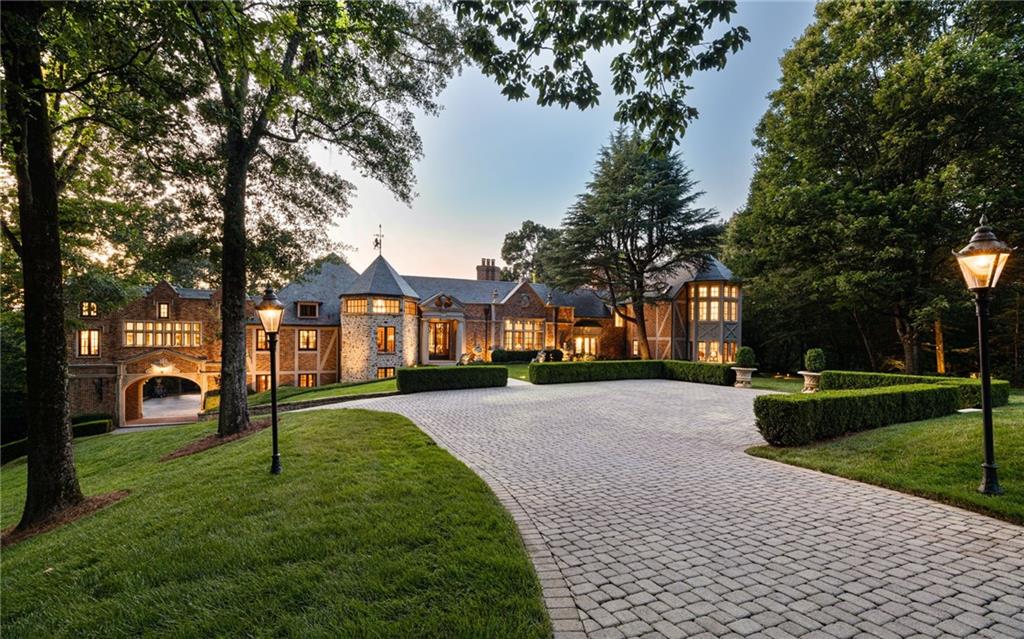 Signature luxury is synonymous with Chestnut Hall, a European inspired English Tudor estate where elegant gates welcome you to over 18 acres of rolling lawn and wooded privacy straddling North Buckhead and Sandy Springs.