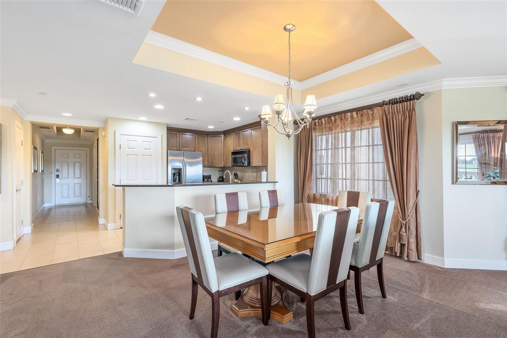 1360 Centre Ct Ridge Drive, Unit 201 Reunion, FL 34747 - Photo 16 of 29 a view of a dining room with furniture window and wooden floor