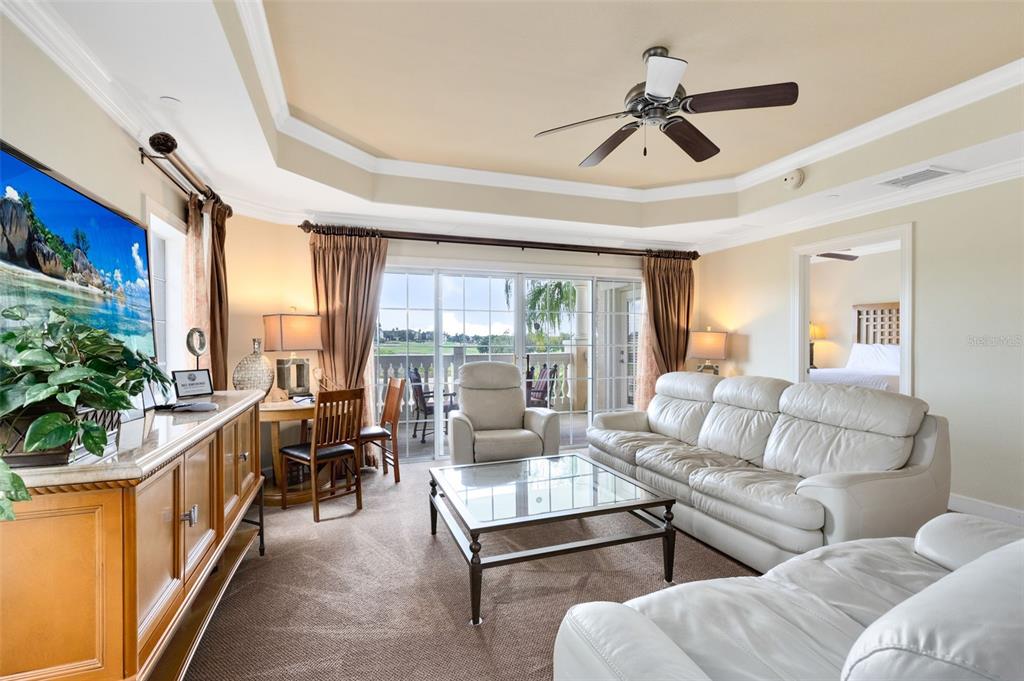 1360 Centre Ct Ridge Drive, Unit 201 Reunion, FL 34747 - Photo 18 of 29 a living room with furniture and a large window