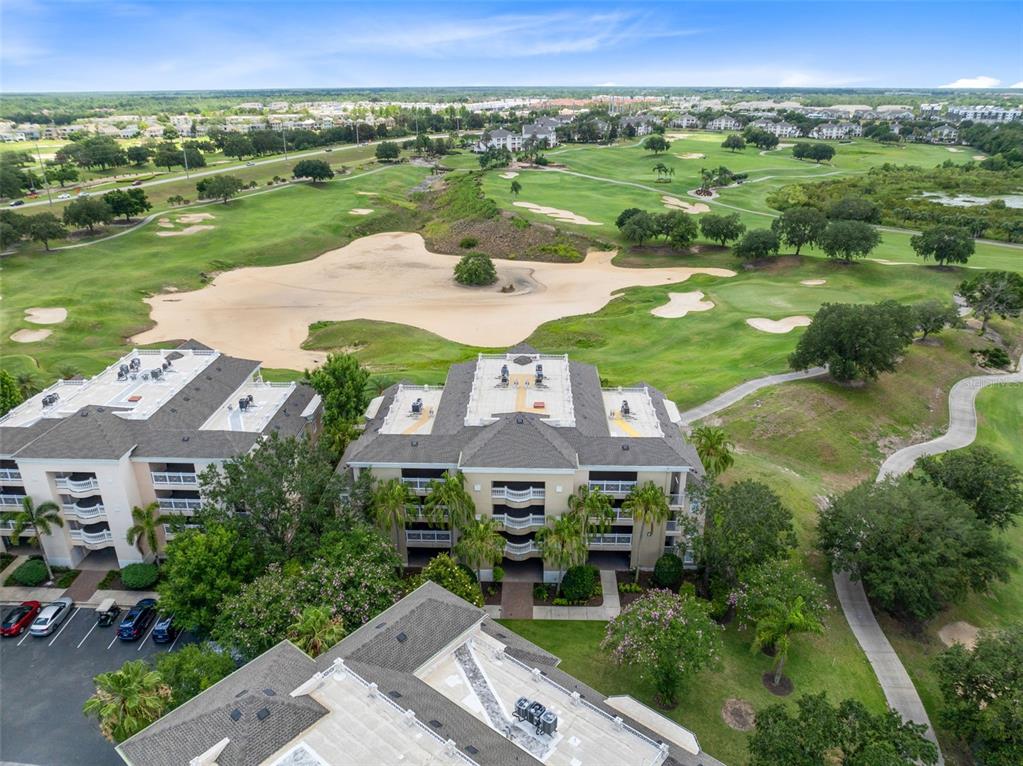 1360 Centre Ct Ridge Drive, Unit 201 Reunion, FL 34747 - Photo 26 of 29 an aerial view of a house with a garden