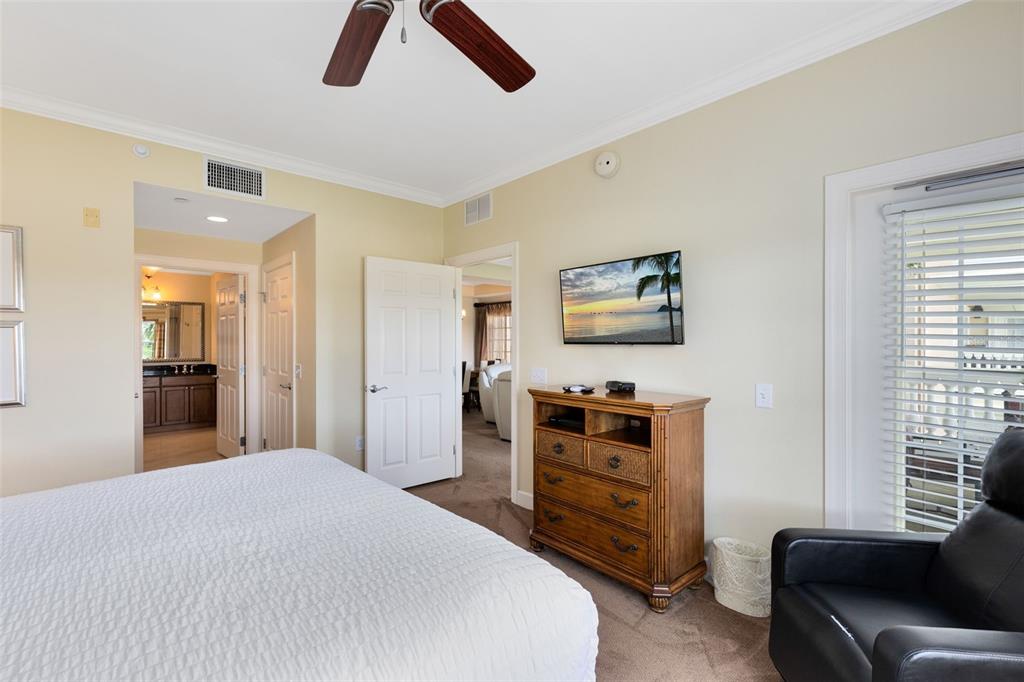 1360 Centre Ct Ridge Drive, Unit 201 Reunion, FL 34747 - Photo 10 of 29 a bedroom with a bed and a couch