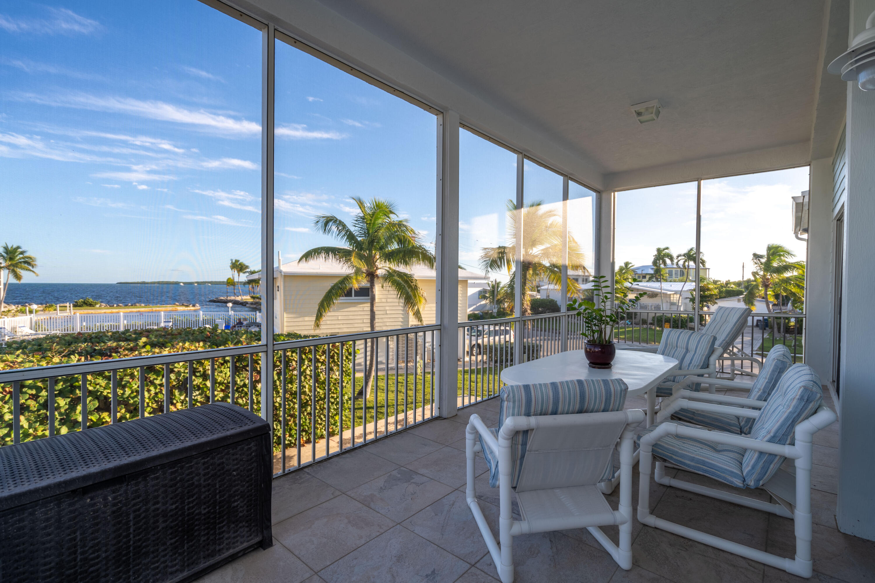 55 Ocean Drive Key Largo, FL 33037 - Photo 18 of 53 a balcony with furniture and city view