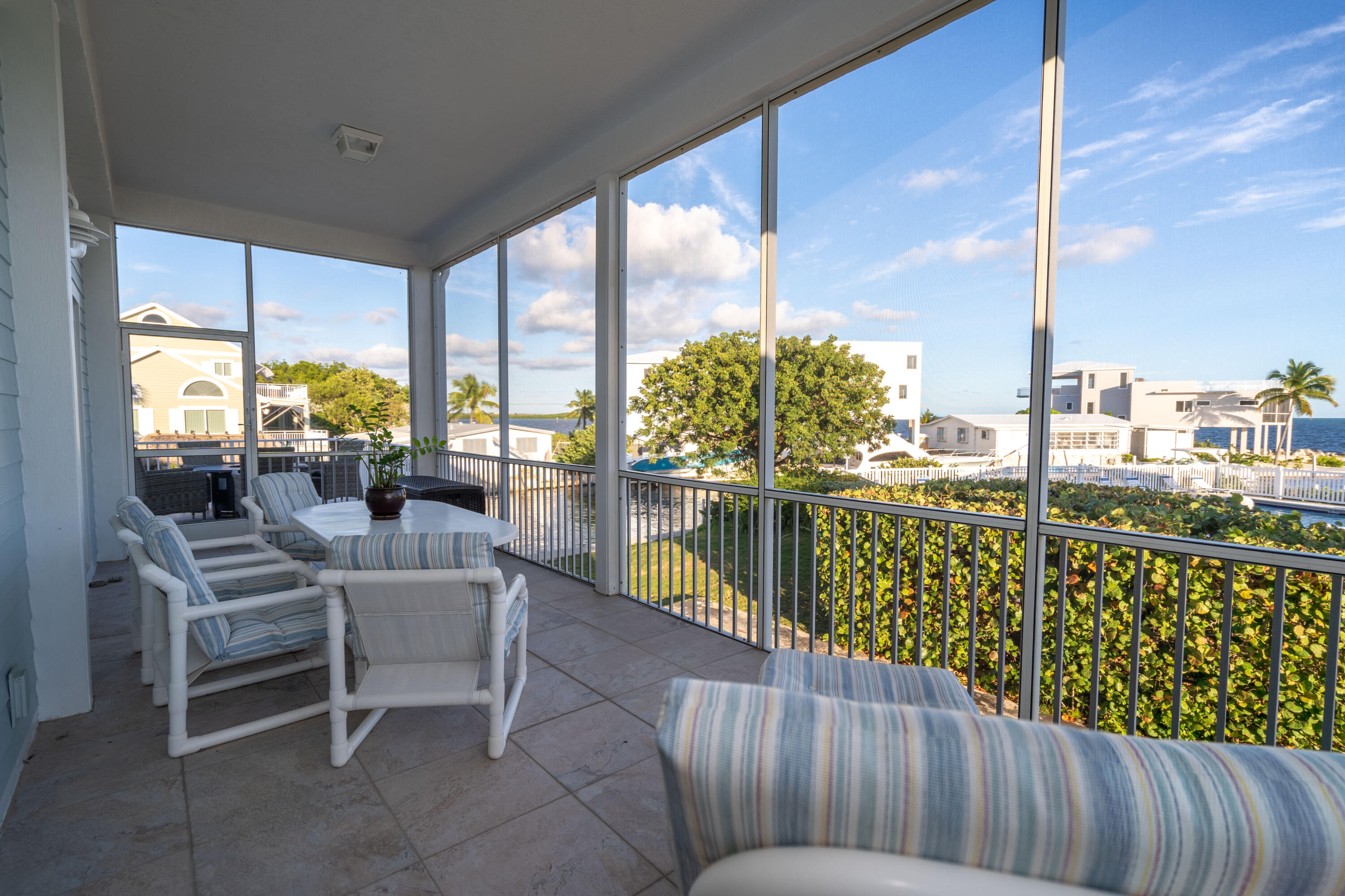 55 Ocean Drive Key Largo, FL 33037 - Photo 19 of 53 a balcony with furniture and city view