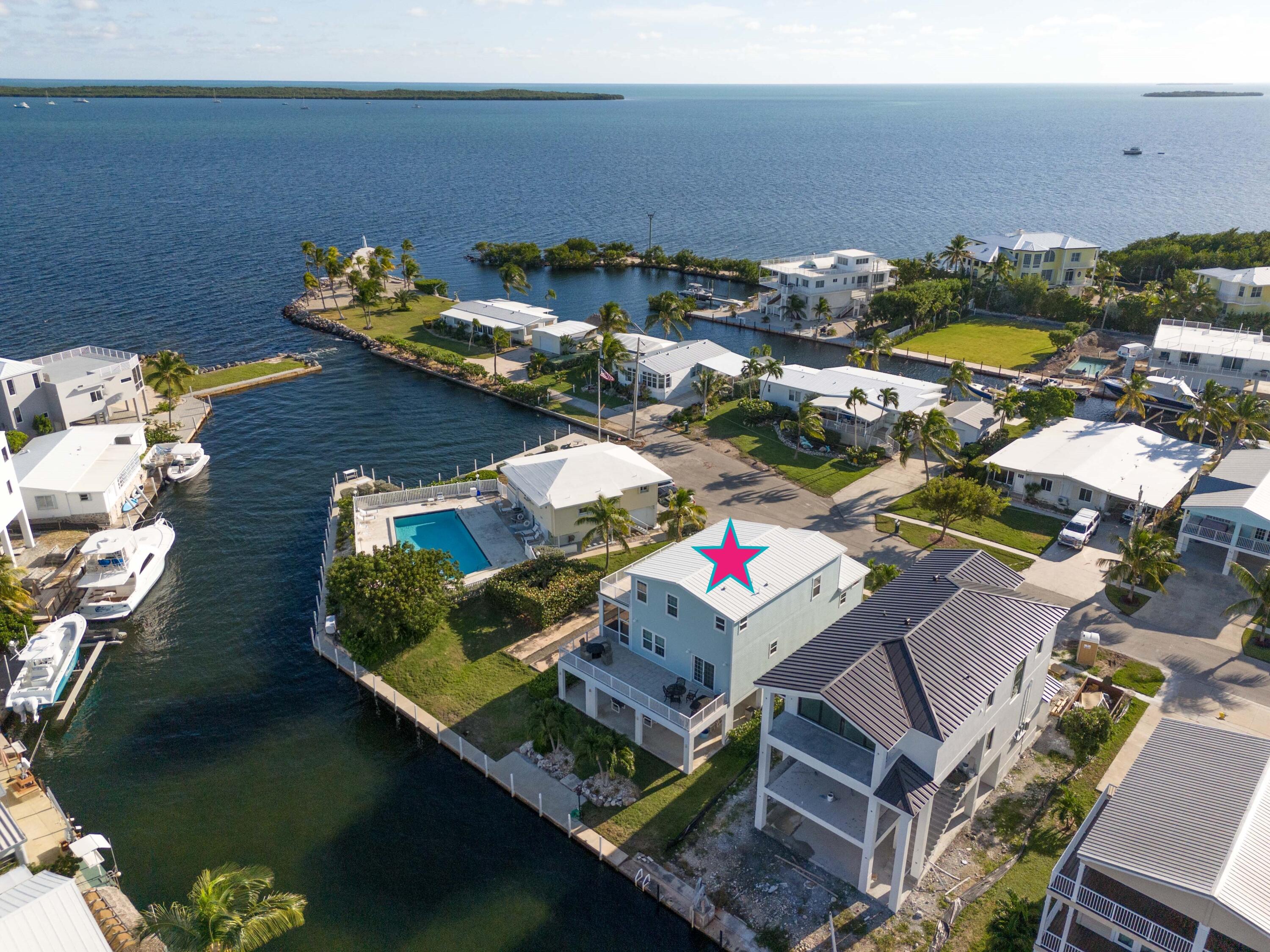 55 Ocean Drive Key Largo, FL 33037 - Photo 2 of 53 an aerial view of a house with a yard