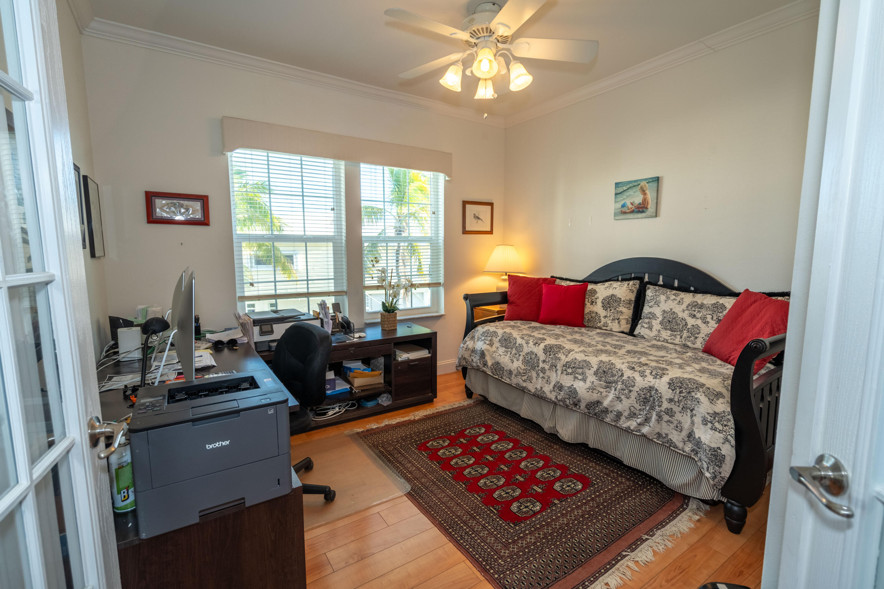 55 Ocean Drive Key Largo, FL 33037 - Photo 24 of 53 a bedroom with a bed a couch and dresser