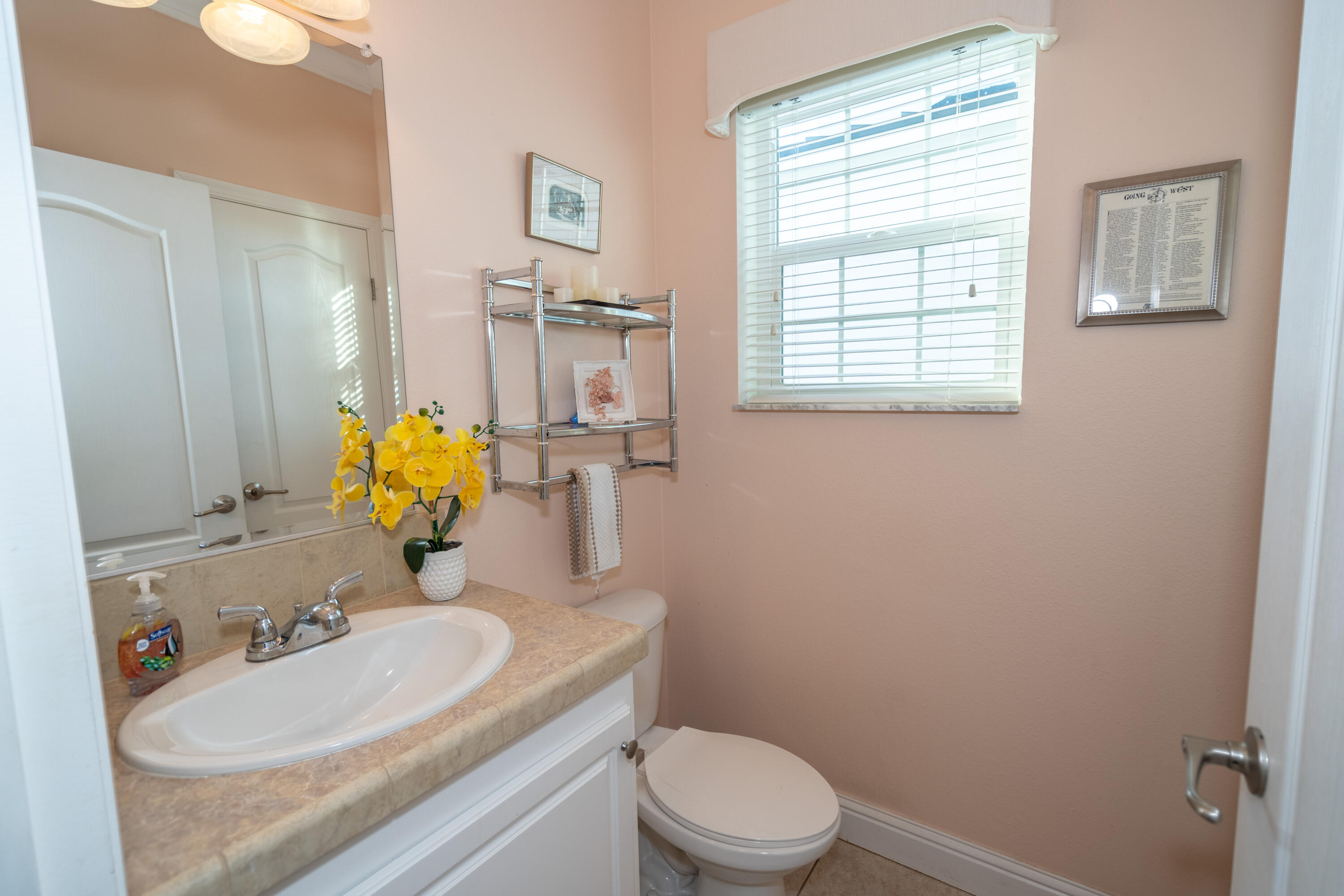 55 Ocean Drive Key Largo, FL 33037 - Photo 25 of 53 a bathroom with a granite countertop toilet sink and mirror