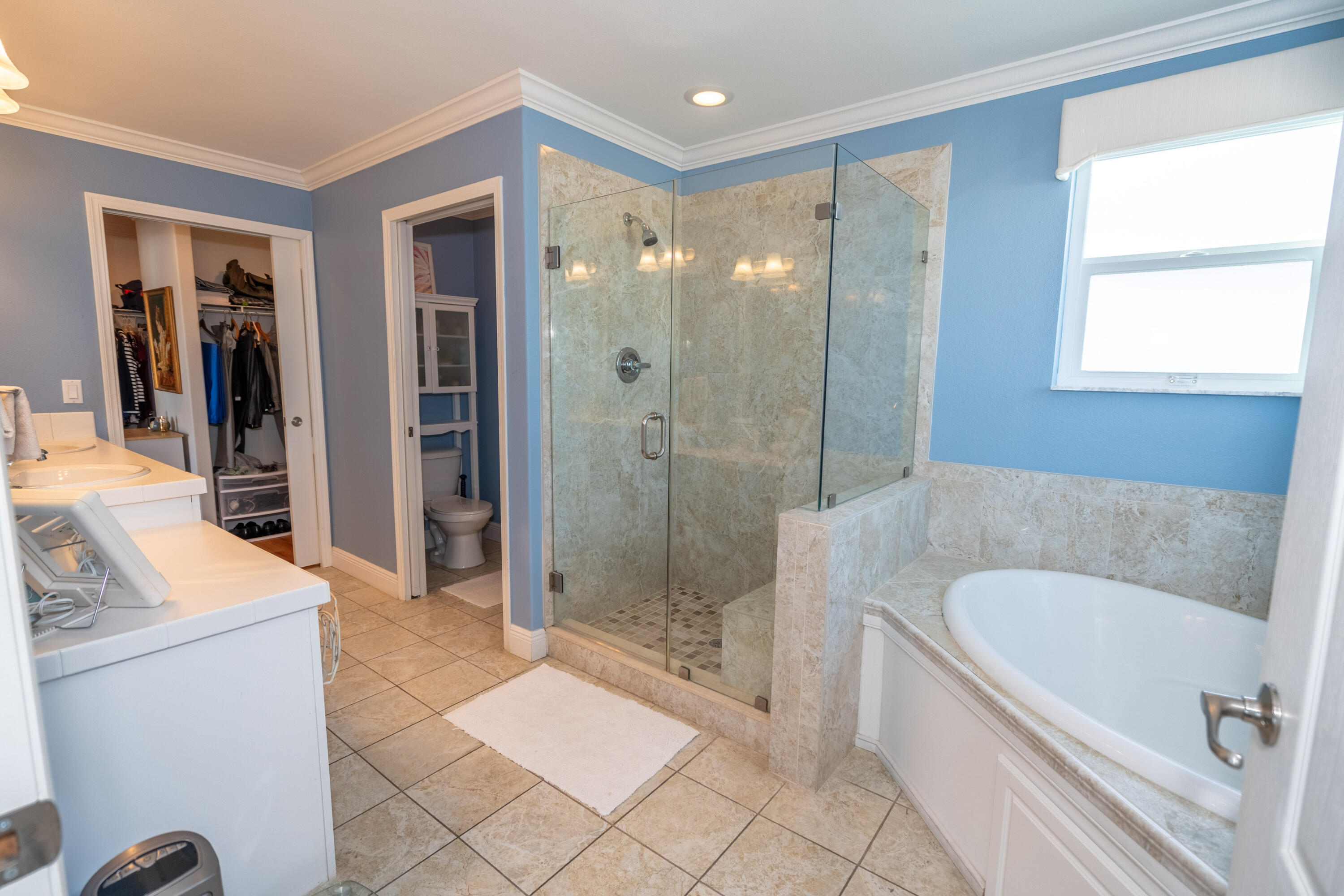 55 Ocean Drive Key Largo, FL 33037 - Photo 31 of 53 a bathroom with a tub a sink and a large mirror