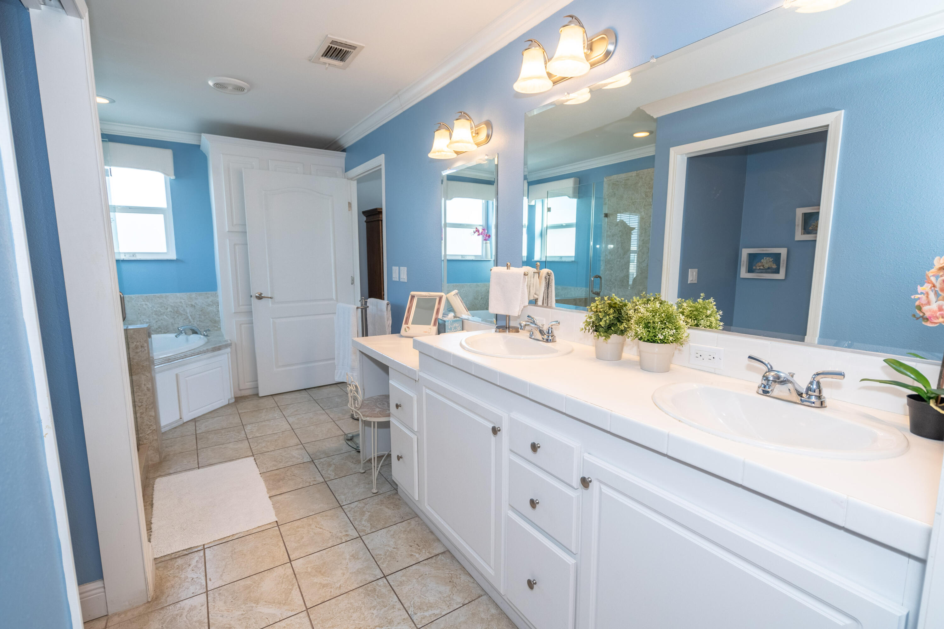 55 Ocean Drive Key Largo, FL 33037 - Photo 32 of 53 a bathroom with a sink a toilet and a mirror