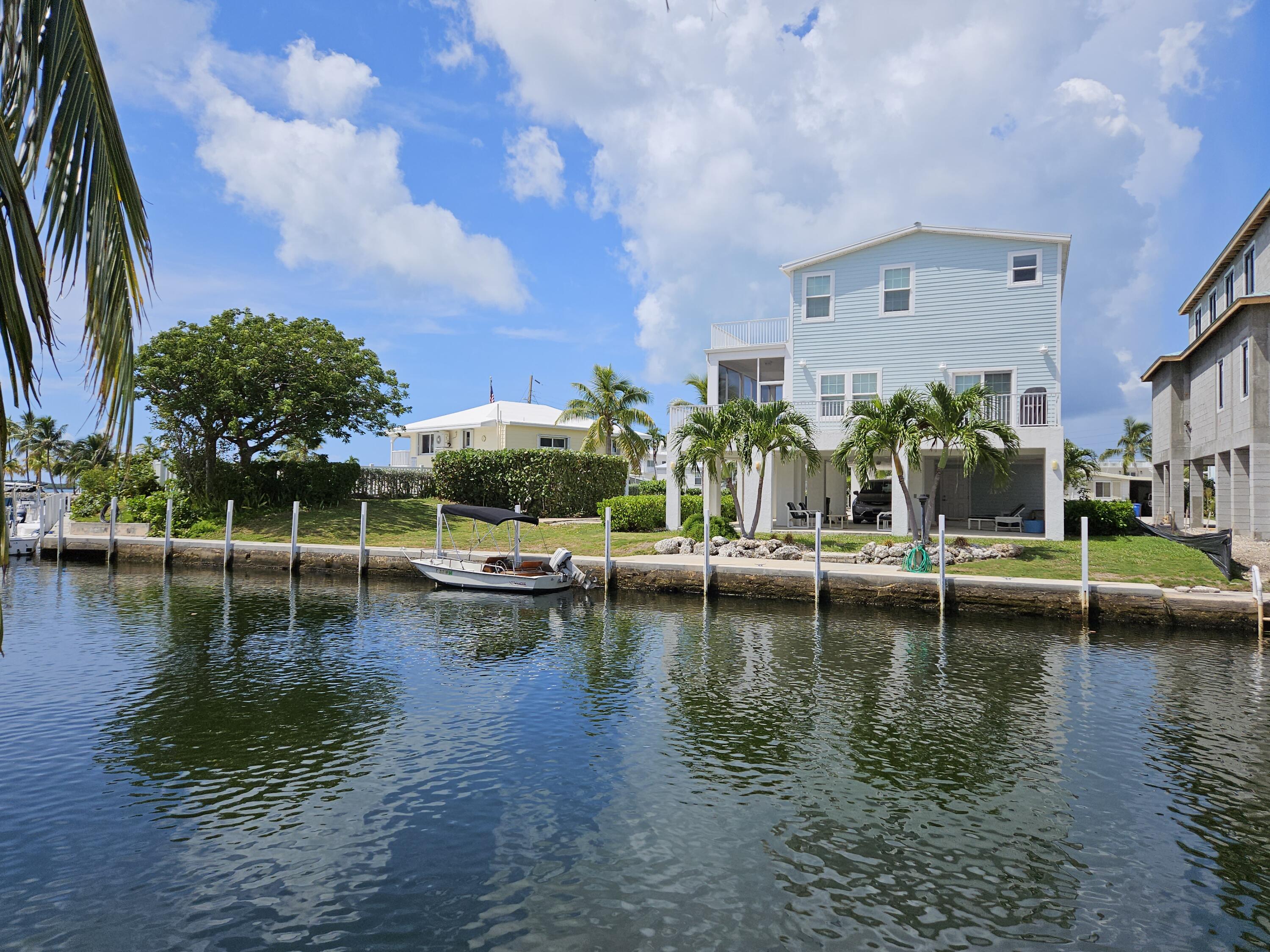 55 Ocean Drive Key Largo, FL 33037 - Photo 34 of 53 a view of swimming pool with outdoor seating and lake view
