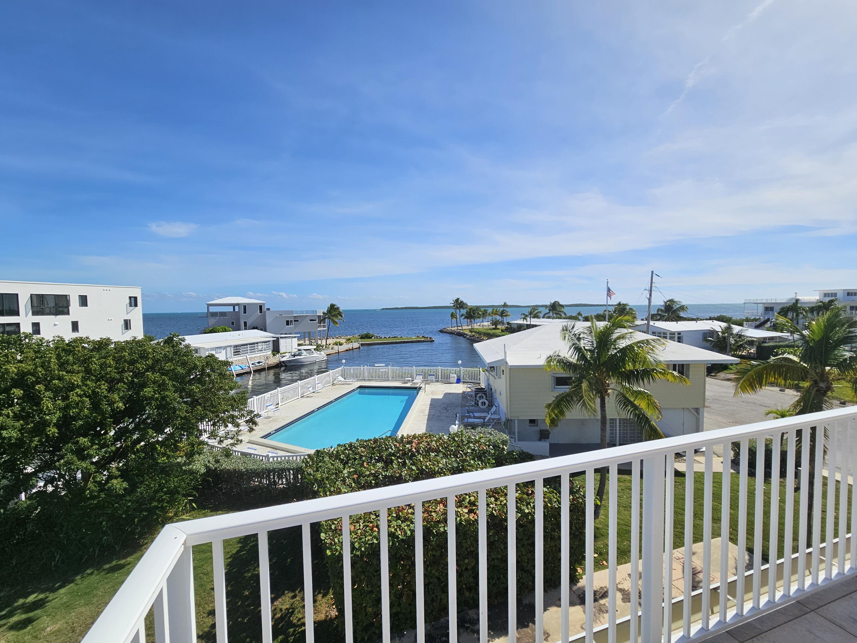 55 Ocean Drive Key Largo, FL 33037 - Photo 37 of 53 a view of a city from a balcony