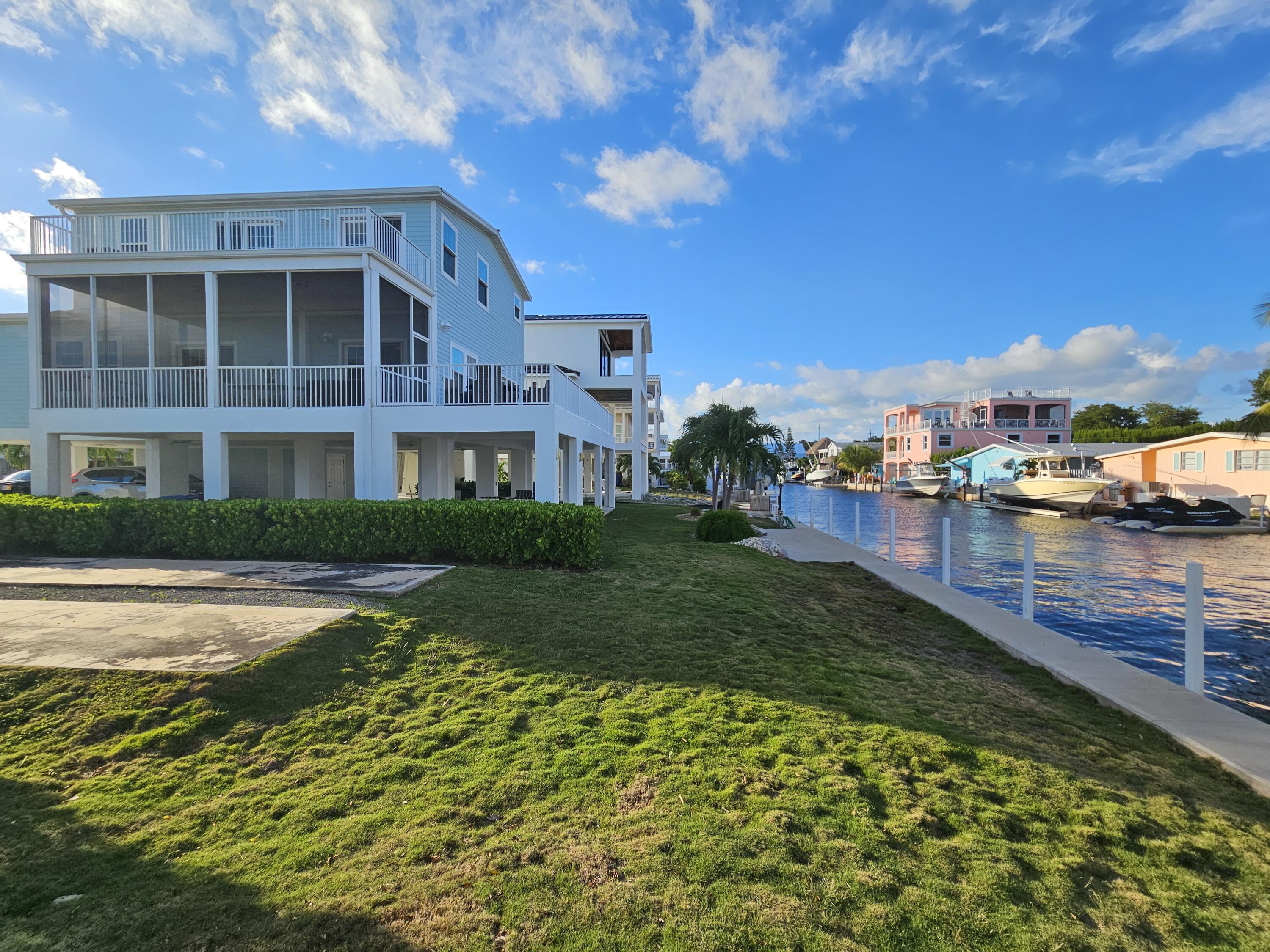 55 Ocean Drive Key Largo, FL 33037 - Photo 41 of 53 a view of a building with a yard