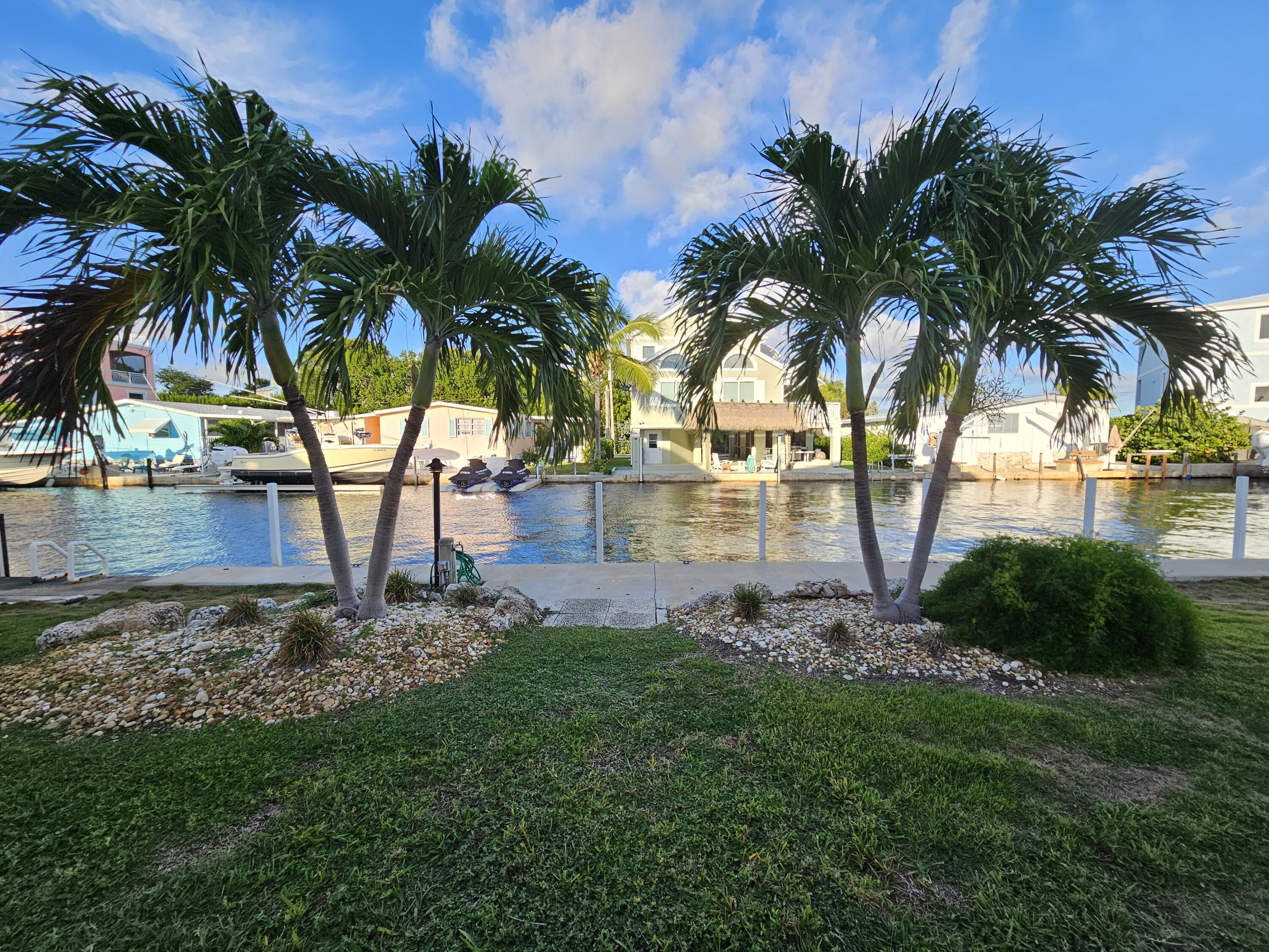 55 Ocean Drive Key Largo, FL 33037 - Photo 42 of 53 a view of a yard with palm trees