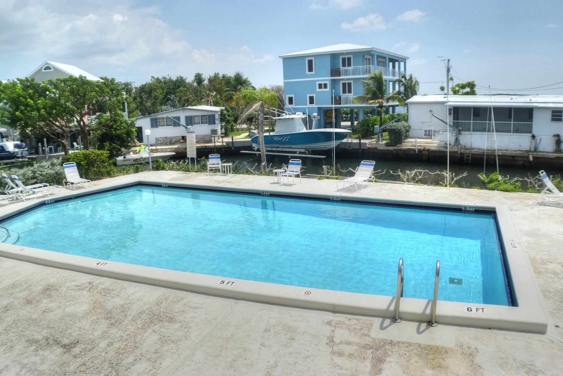 55 Ocean Drive Key Largo, FL 33037 - Photo 46 of 53 a view of a house with pool garden and sitting area