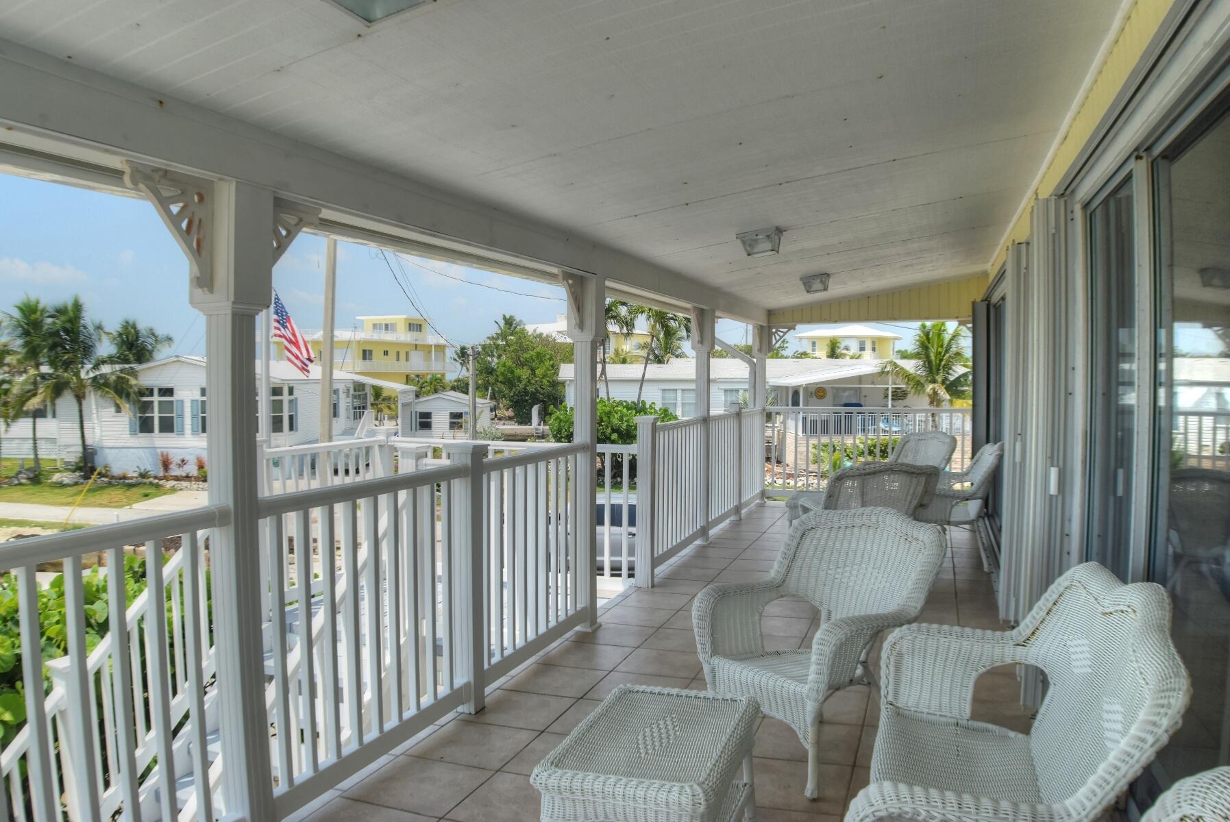 55 Ocean Drive Key Largo, FL 33037 - Photo 47 of 53 a living room with furniture and windows
